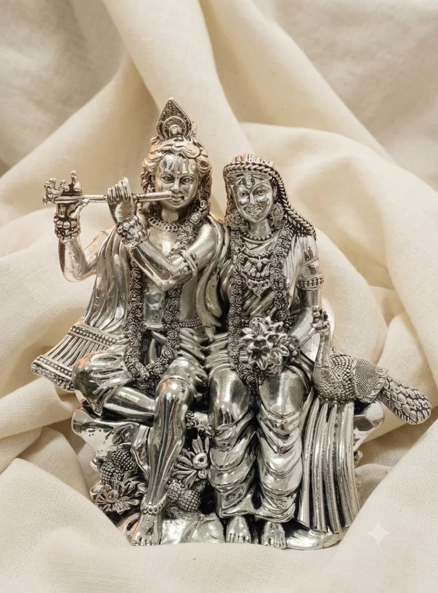 Radha Krishna idol in sterling silver, drapery worked in relief